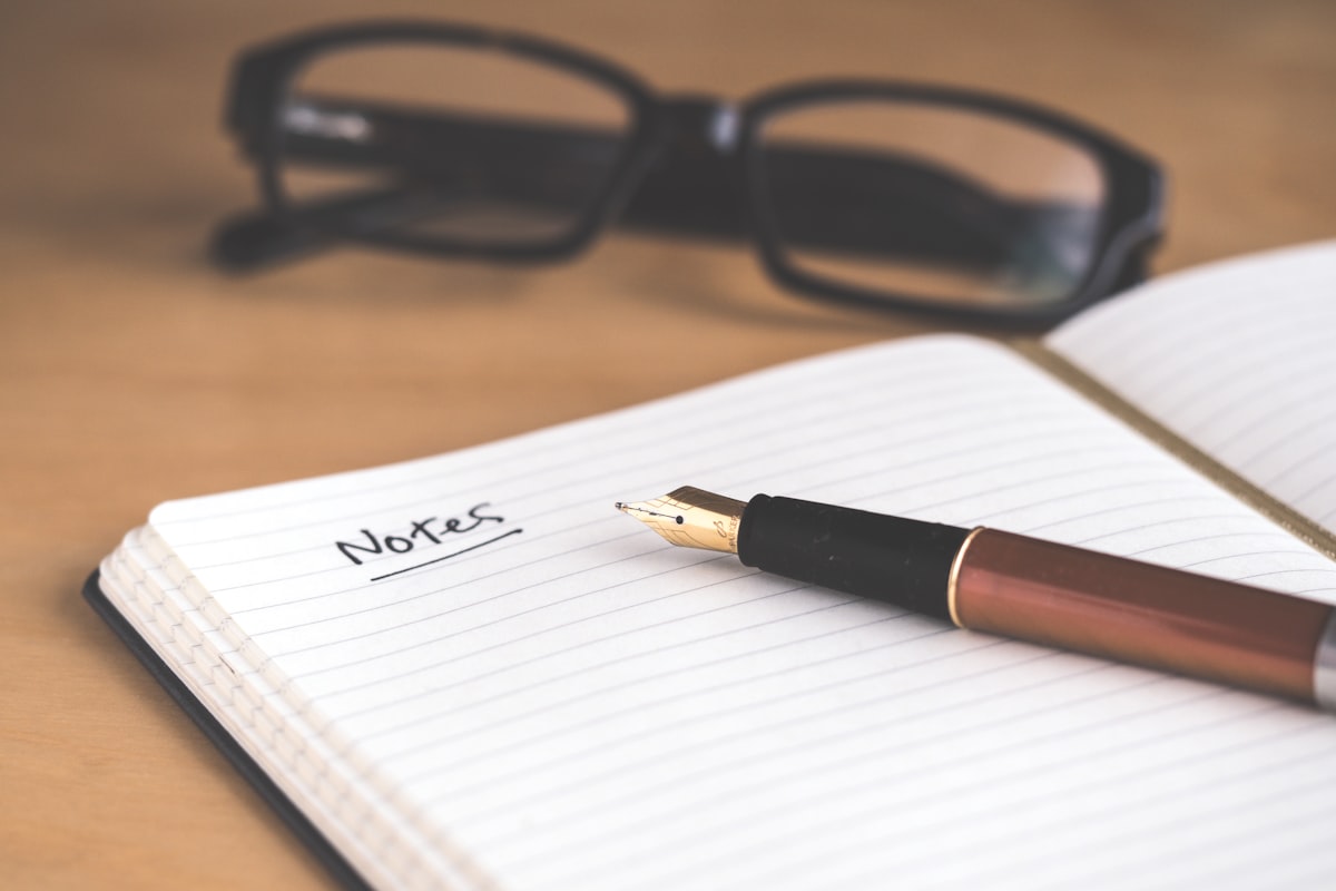 A notebook and pen on a desk โ the quiet setup I returned to after a few weeks away from publishing