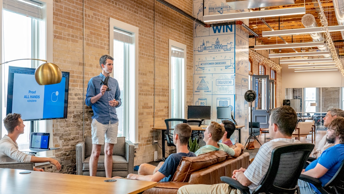 A team collaborating in a bright office, representing modern meeting and note-taking workflows